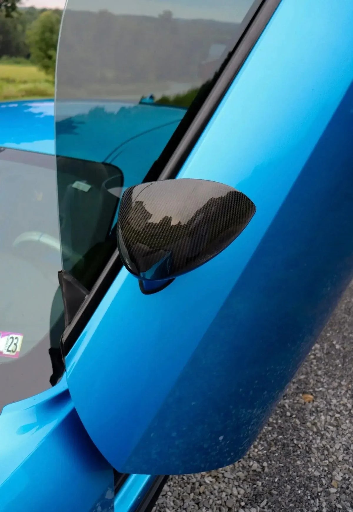 Carbon fiber side mirror cover on blue sports car, real carbon fiber auto accessory for Chevy Camaro or Mustang