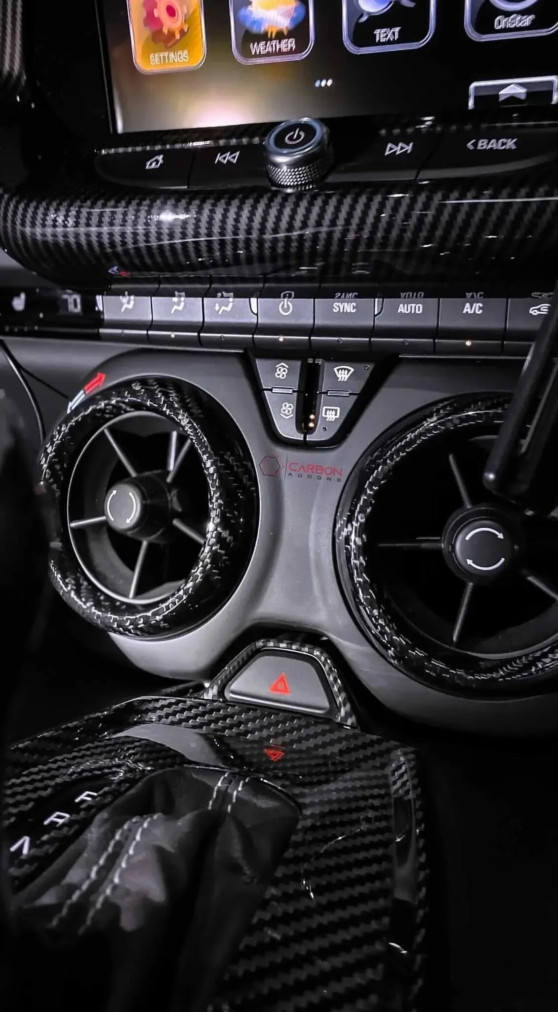 Real carbon fiber interior trim for car dashboard, air vents, and gear shift with sleek black weave finish