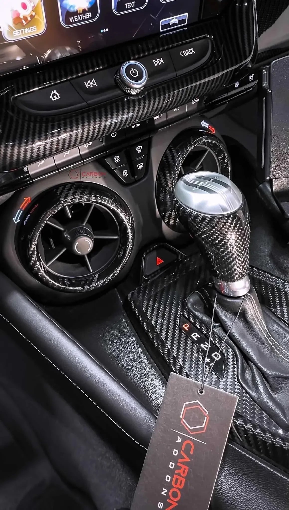 Real carbon fiber interior trim kit with gear shifter, air vents, and center console for American vehicles