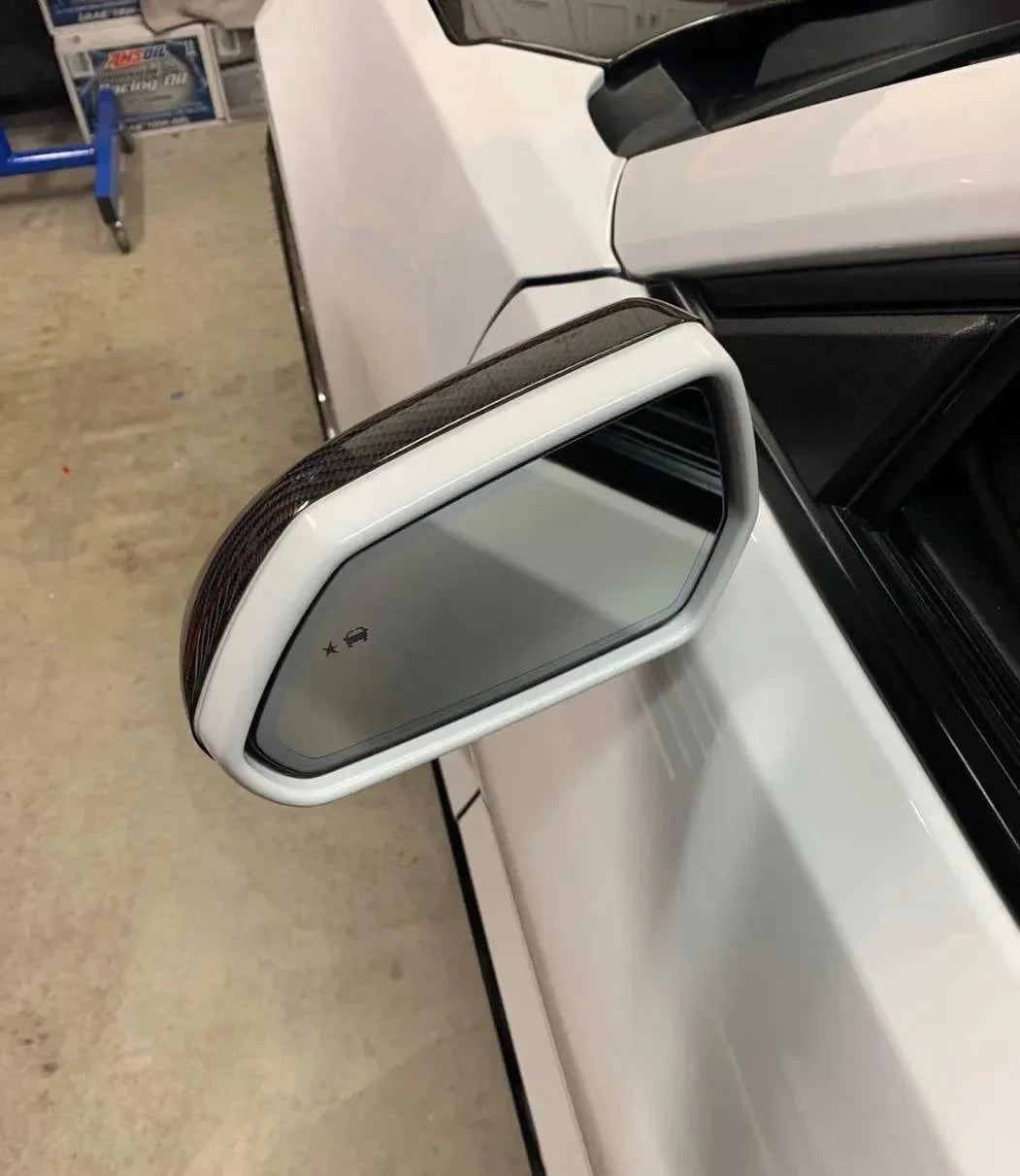 Real carbon fiber side mirror cover for white American muscle car, sleek exterior upgrade