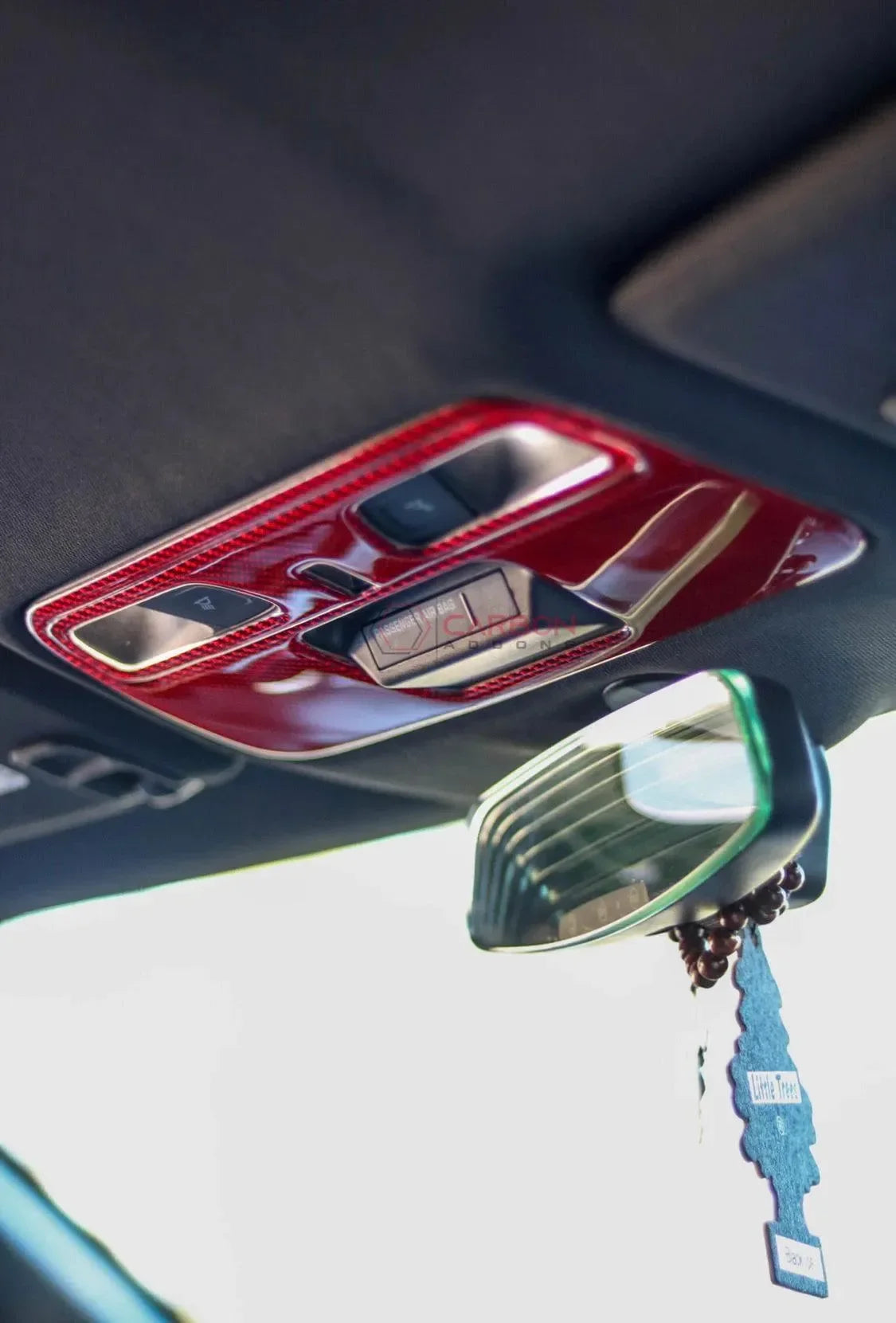 Red carbon fiber interior trim for American vehicles, enhancing luxury and style.
