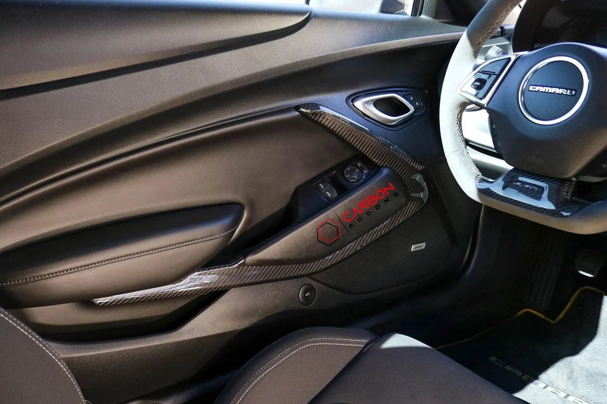 Chevy Camaro interior with real carbon fiber door panel trim and steering wheel accents