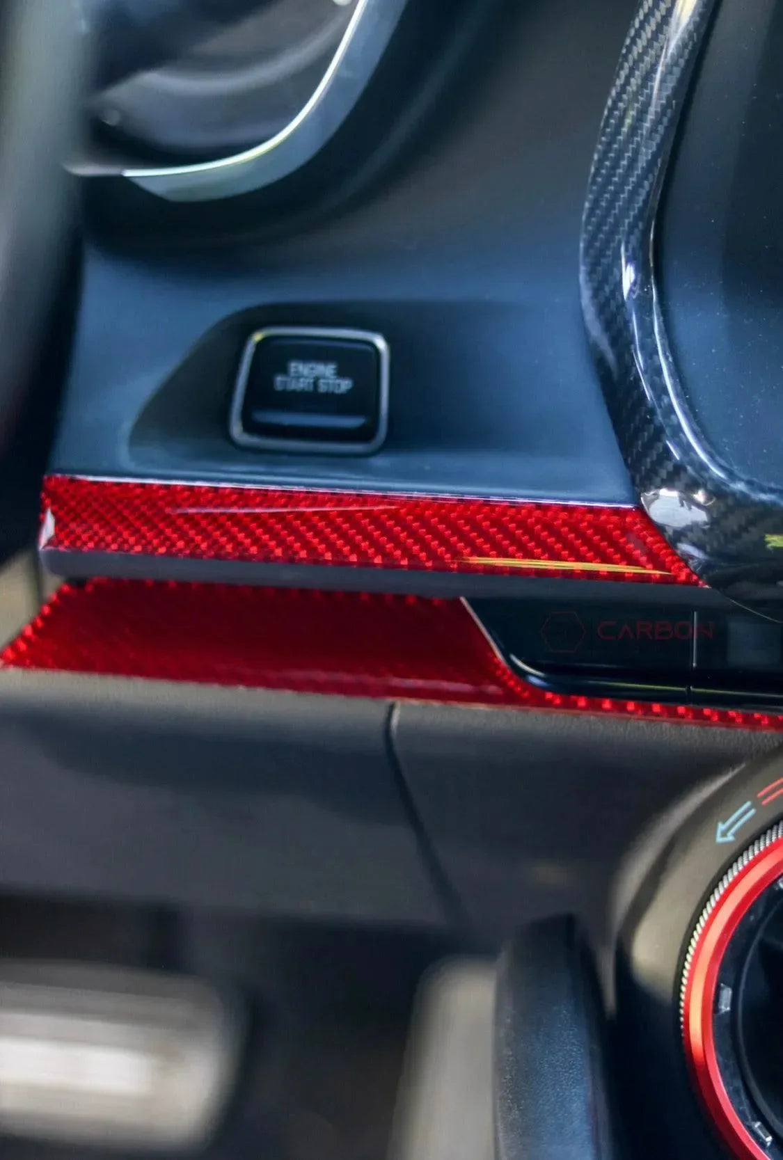 Red carbon fiber interior trim for car dashboard and start stop button area