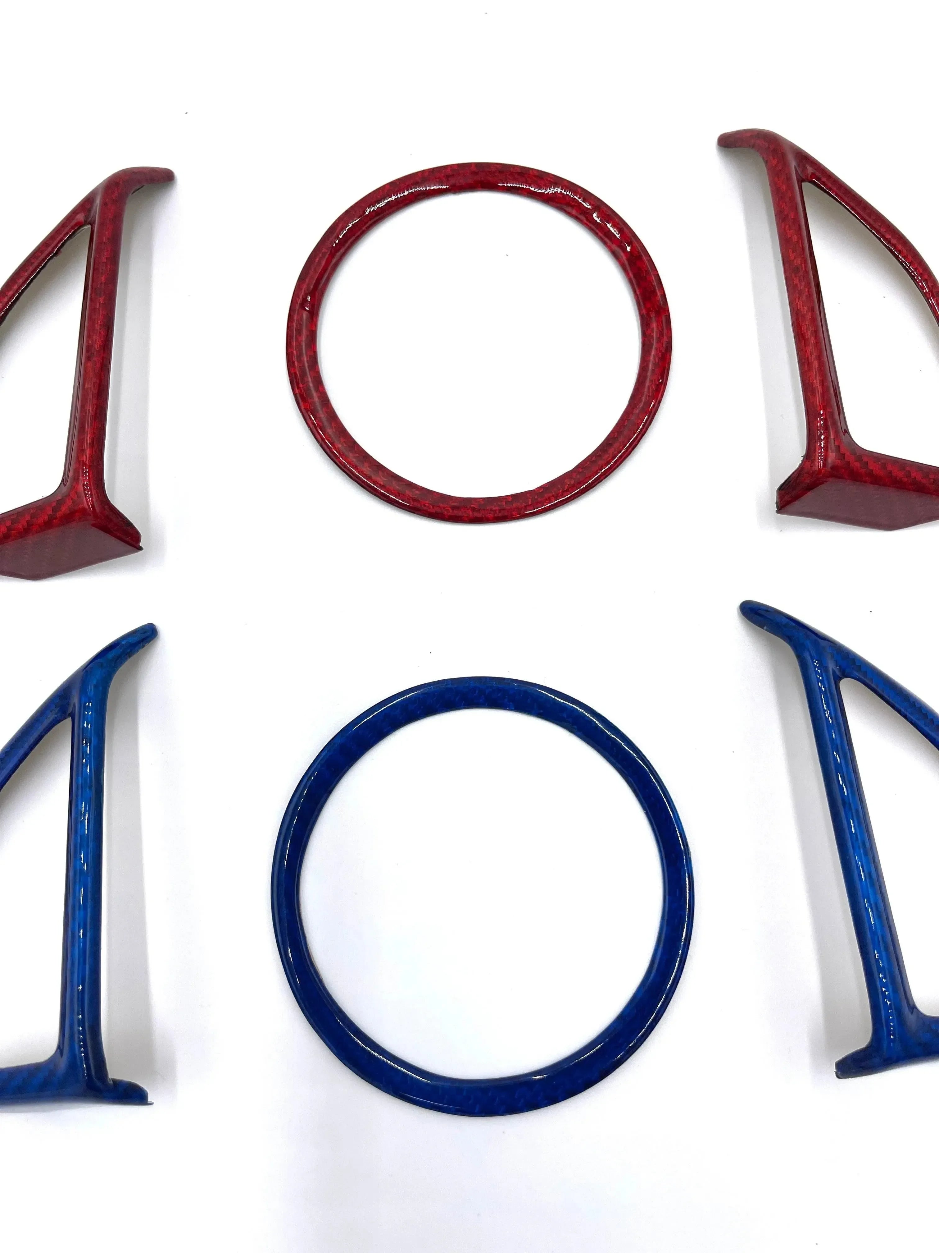 Red and blue carbon fiber car emblem overlays for Chevy, Ford, Dodge vehicles