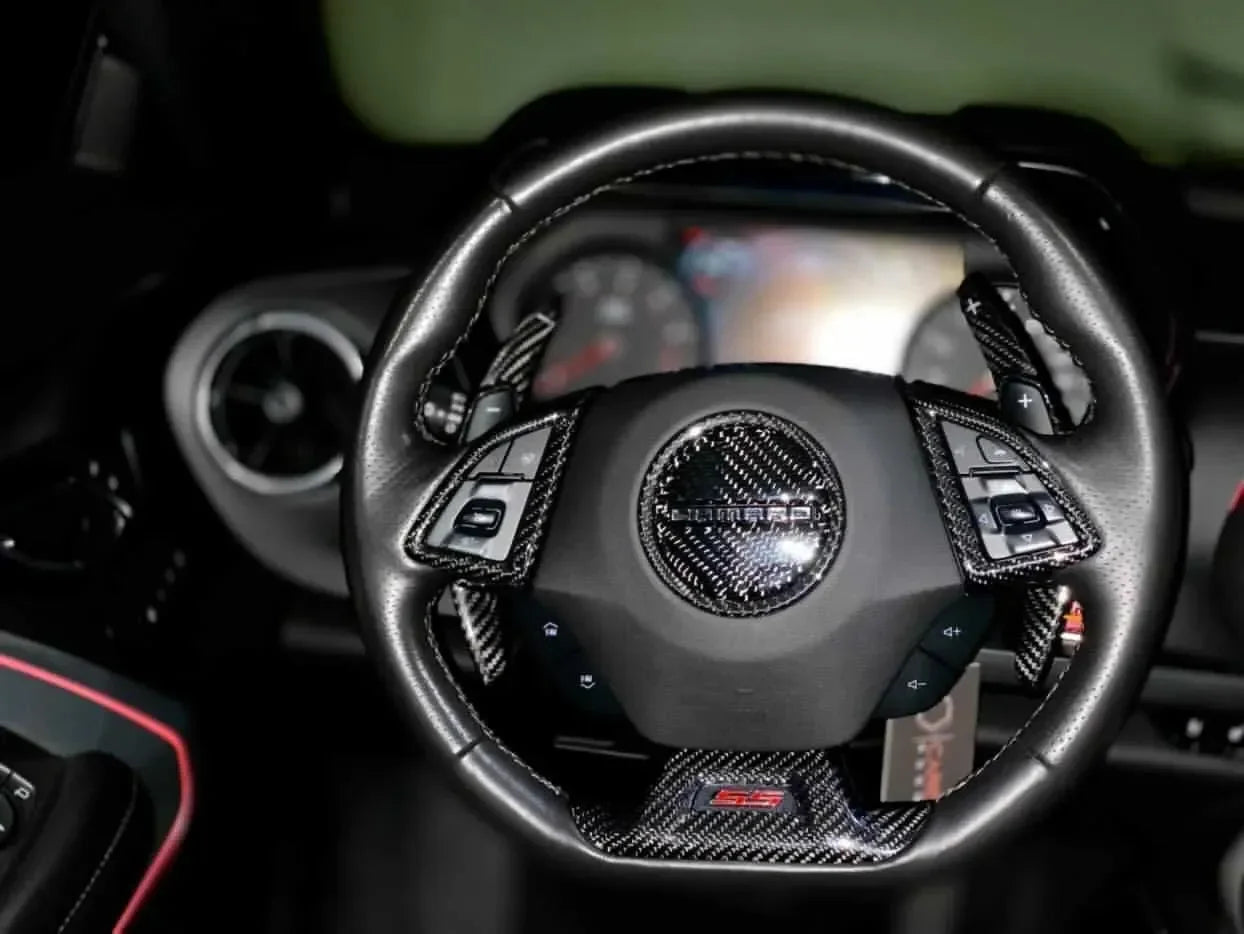 Real carbon fiber steering wheel trim for Chevy Camaro SS, enhancing interior with sleek, lightweight accents.