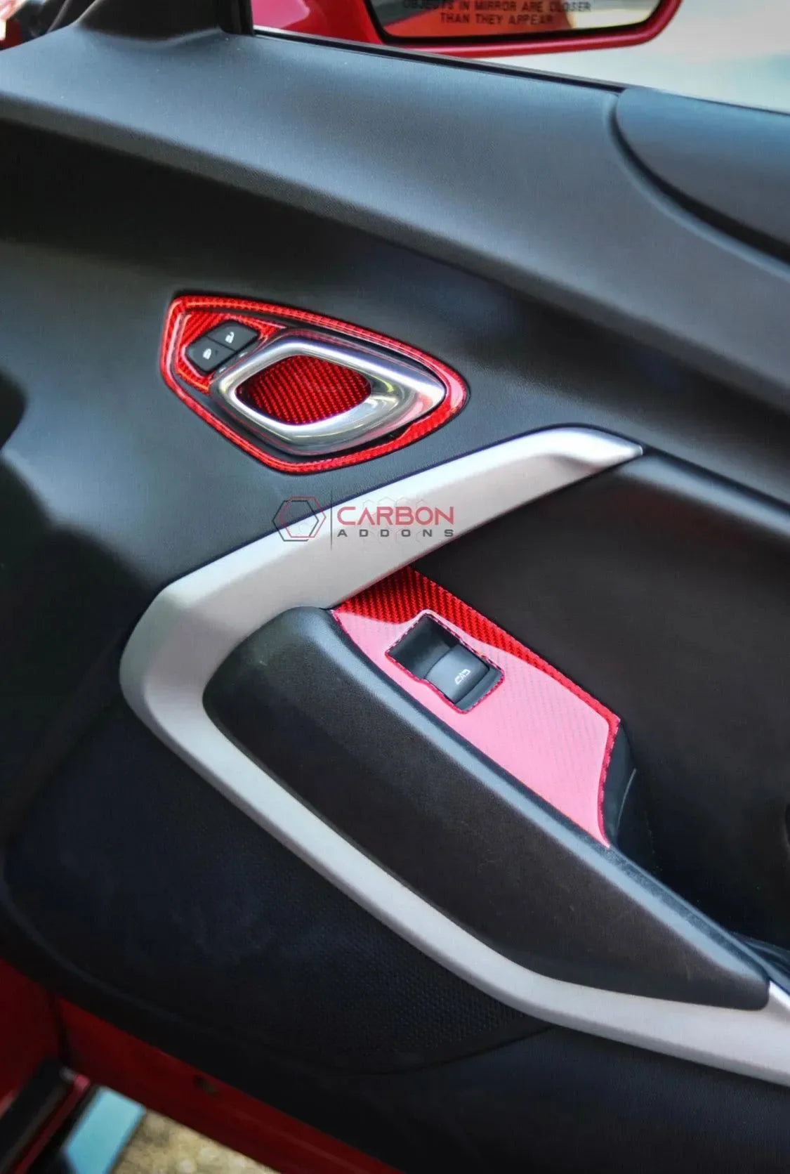 Red carbon fiber door panel accents for American vehicles, enhancing interior style and luxury.