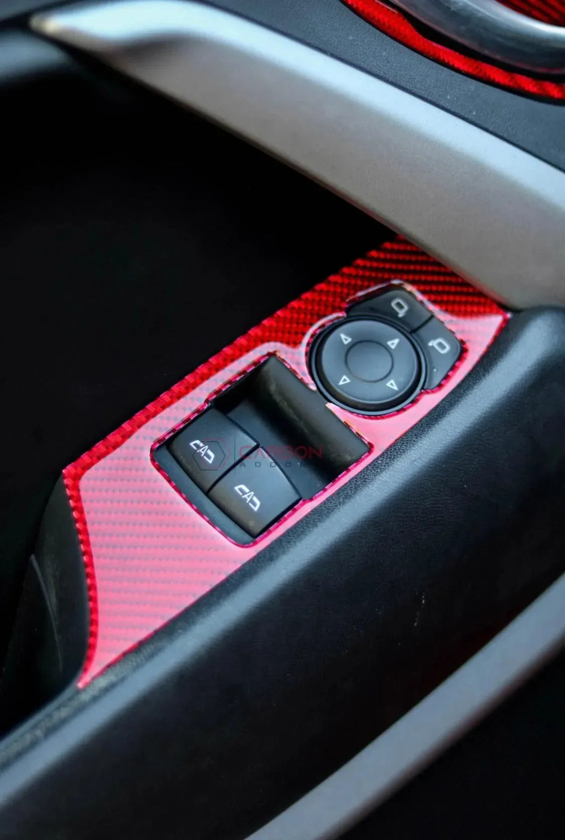 Red carbon fiber interior trim with control buttons for American vehicles