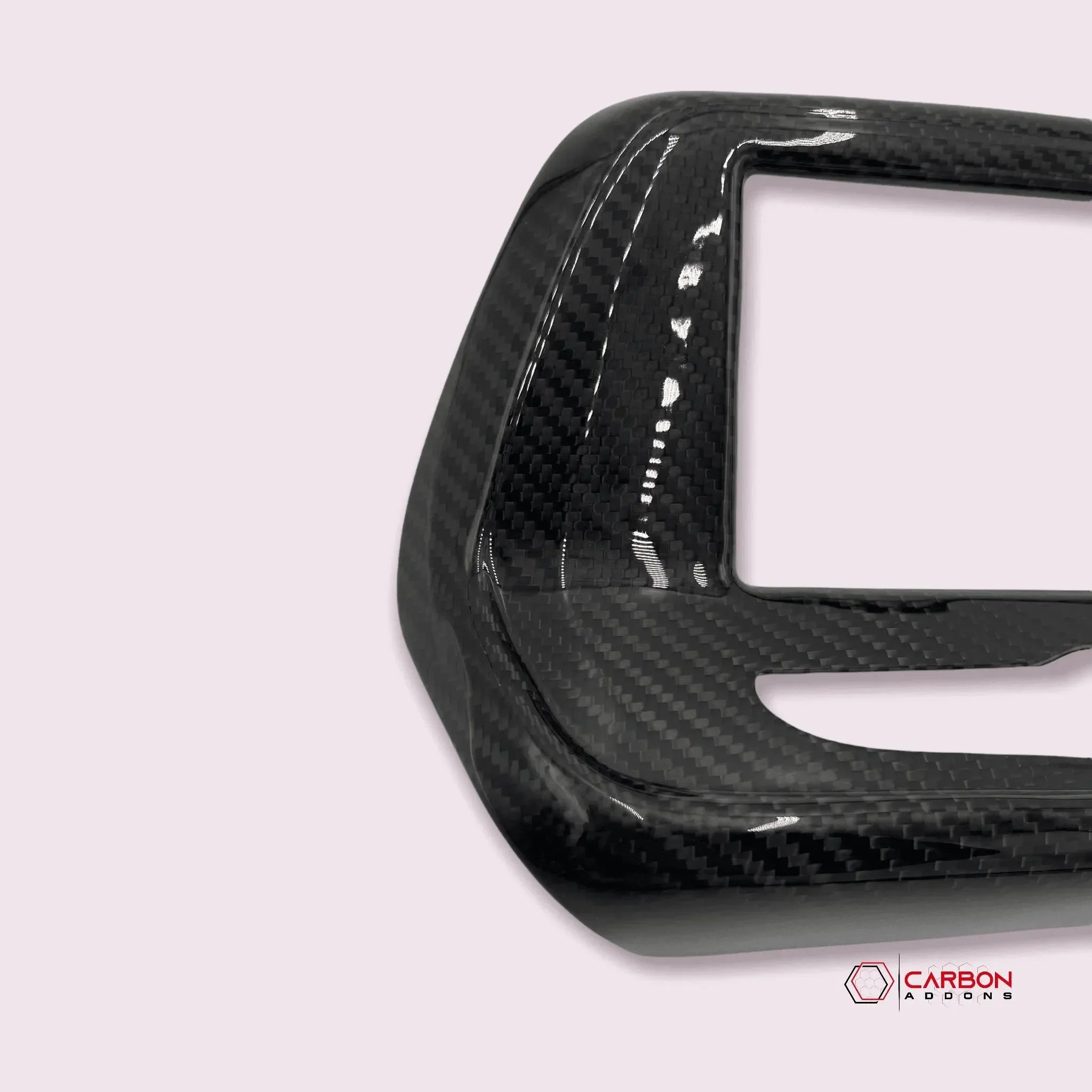 Glossy real carbon fiber automotive trim panel for American vehicles, showcasing weave texture and sleek finish