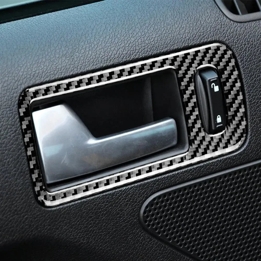 Carbon fiber interior trim for car door handle and lock switch, enhancing vehicle aesthetics with real carbon fiber accents.