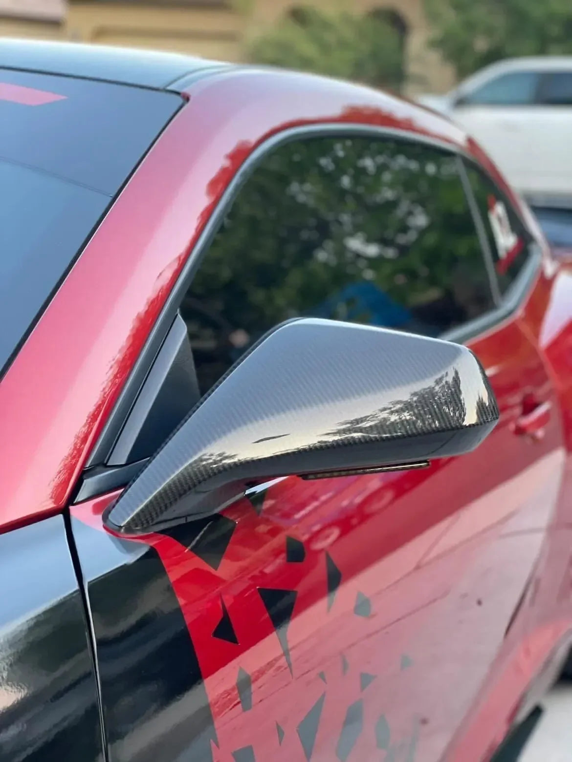 Glossy carbon fiber side mirror on red sports car, real carbon fiber auto accessory for Mustang or Camaro