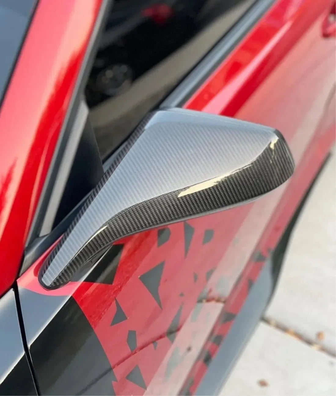 Real carbon fiber side mirror cover for red American muscle car, sleek gloss finish