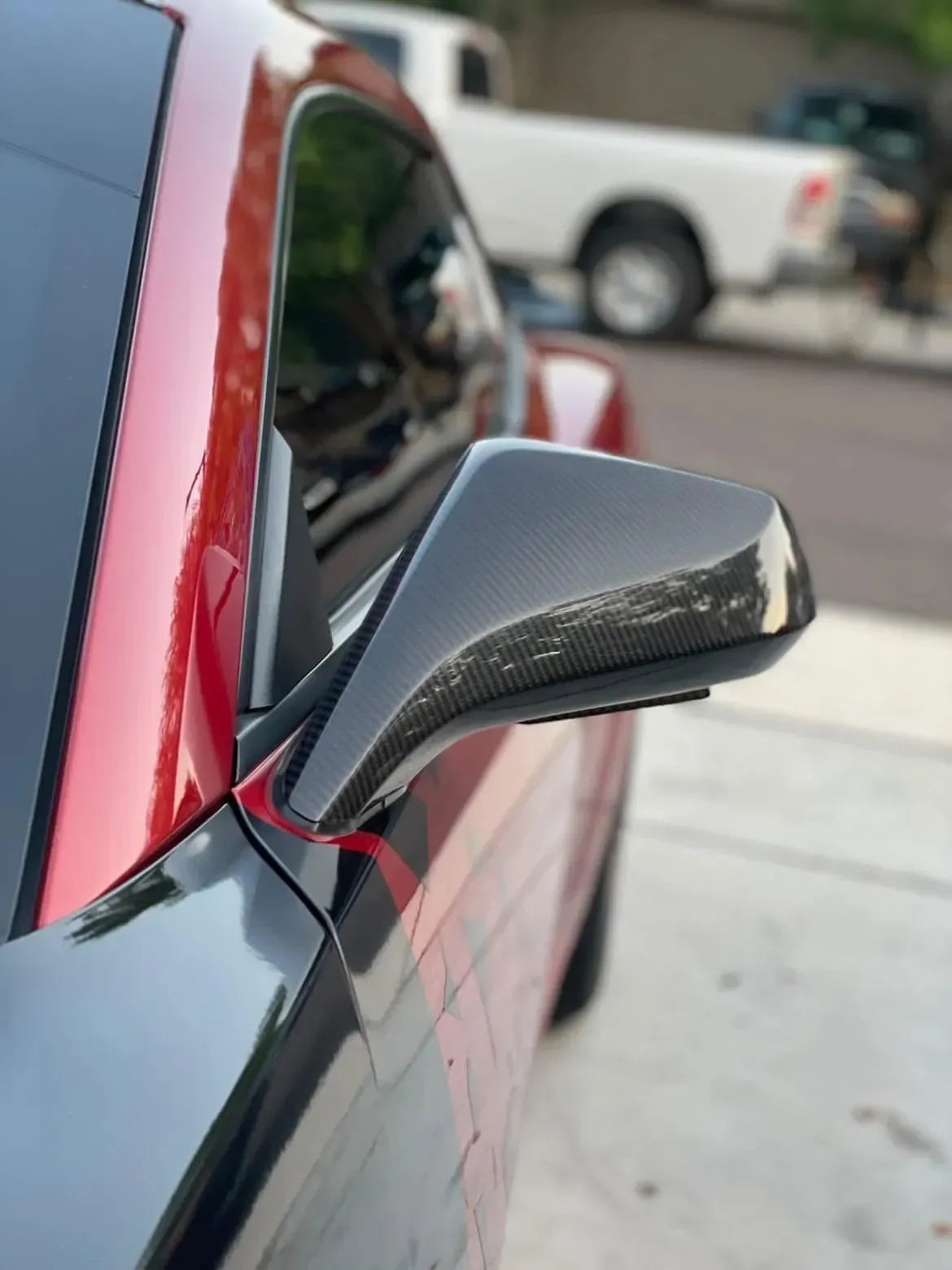 Glossy carbon fiber side mirror on red sports car, real carbon fiber auto accessory for American vehicles