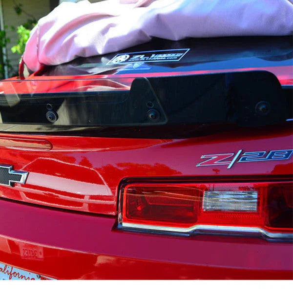 Red car with 'Z28' badge on a blurred background