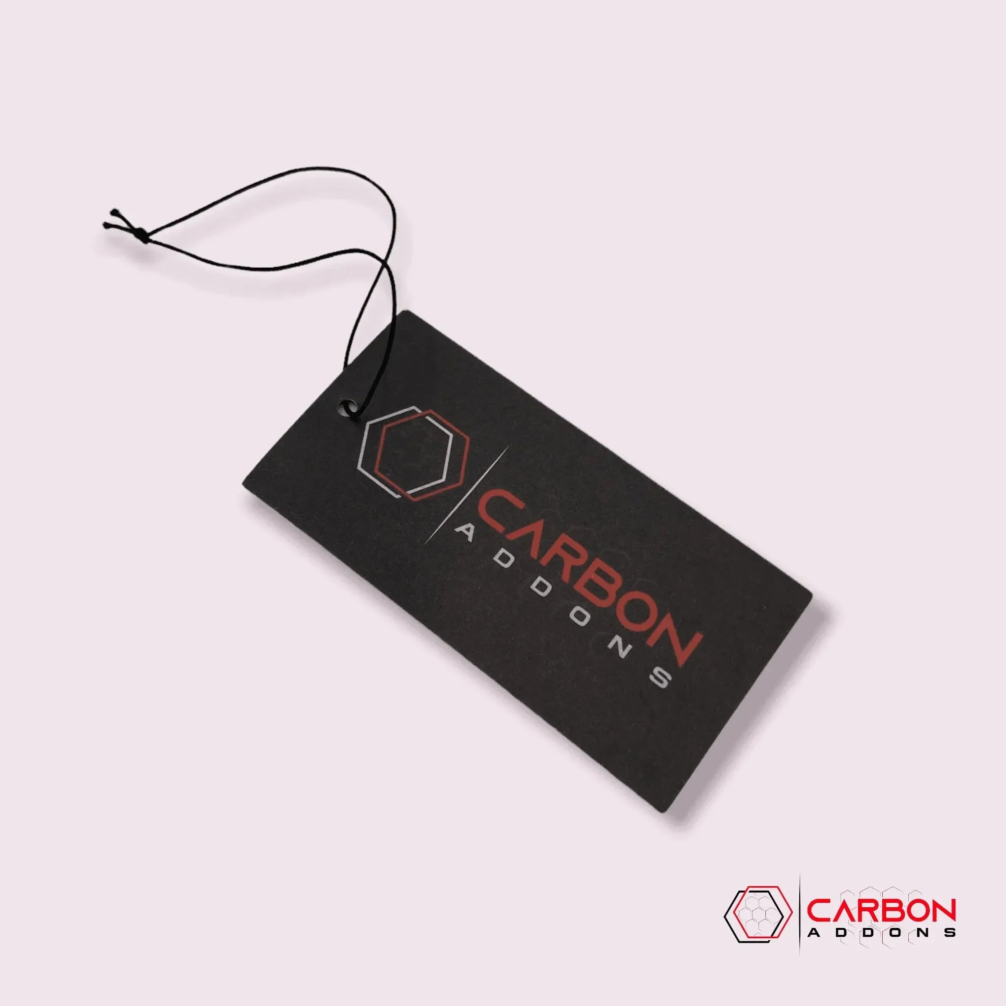 Carbon Addons brand tag with hexagon logo on black card, for real carbon fiber auto parts and accessories.