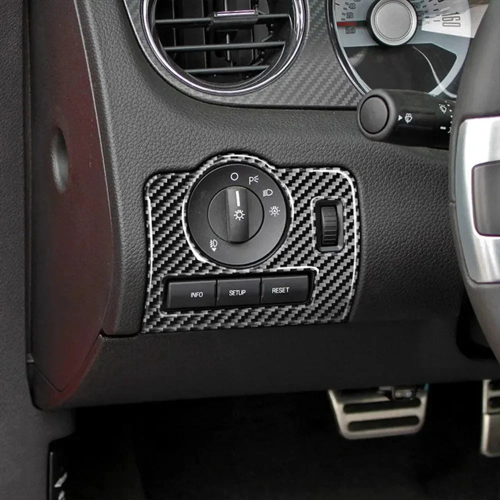 Real carbon fiber interior trim for car dashboard controls, enhancing style and performance.