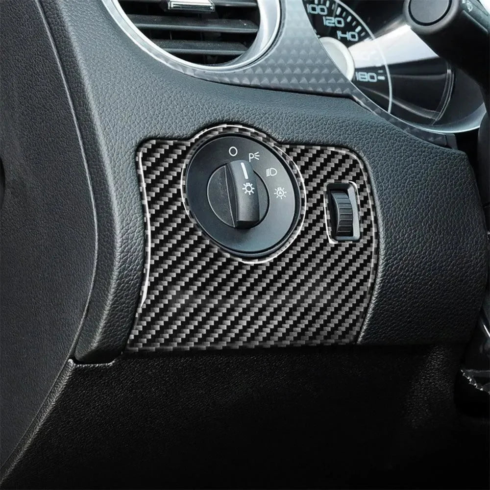 Real carbon fiber interior trim for car dashboard, enhancing steering wheel controls with sleek, durable finish.