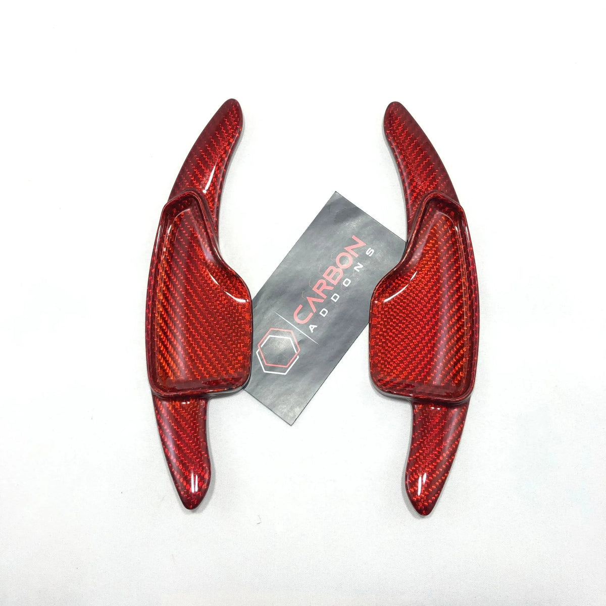 Red carbon fiber automotive trim pieces for American muscle cars, glossy finish with weave texture
