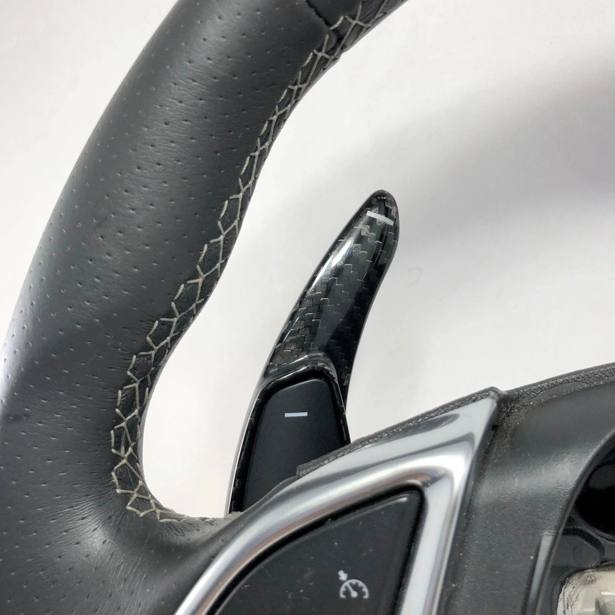 Carbon fiber steering wheel paddle shifter with perforated leather grip