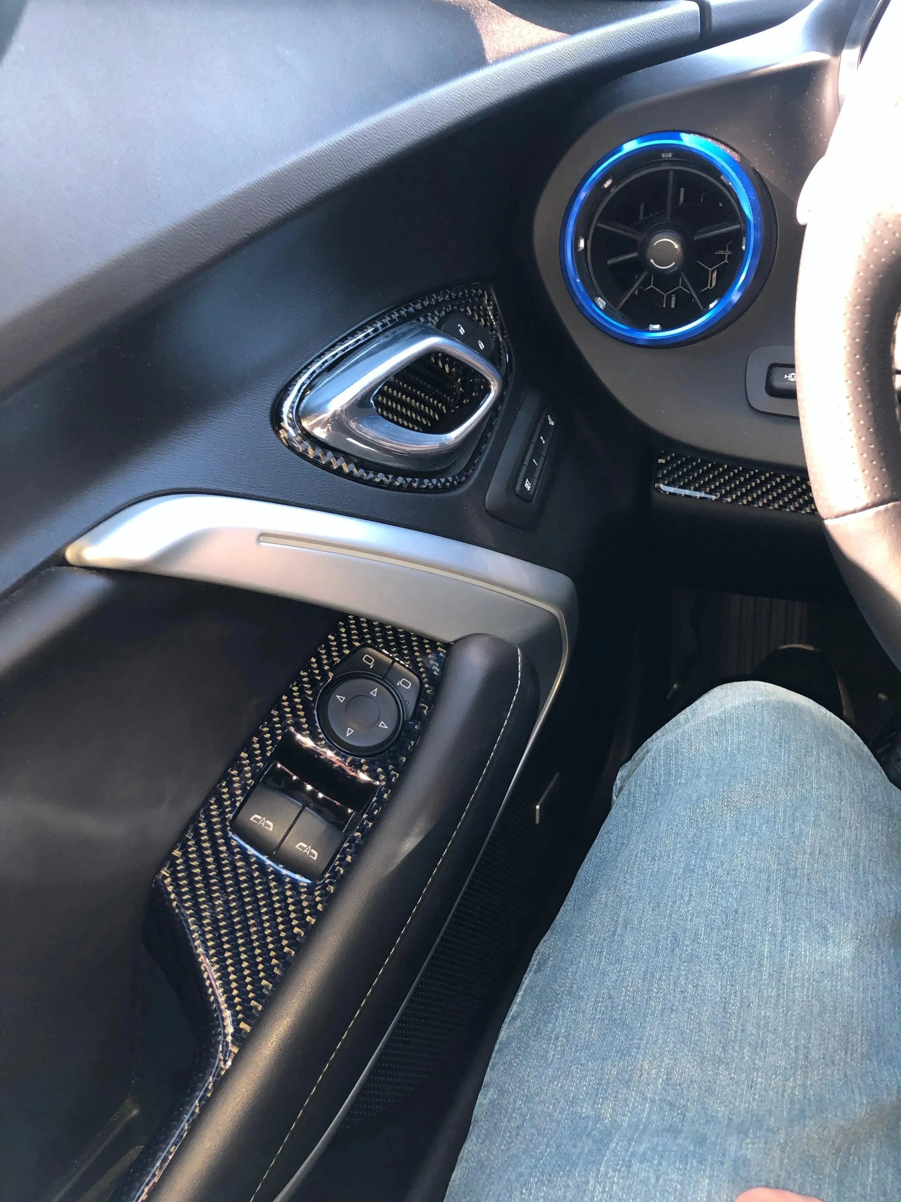 Carbon fiber interior trim with blue LED accents for American vehicles