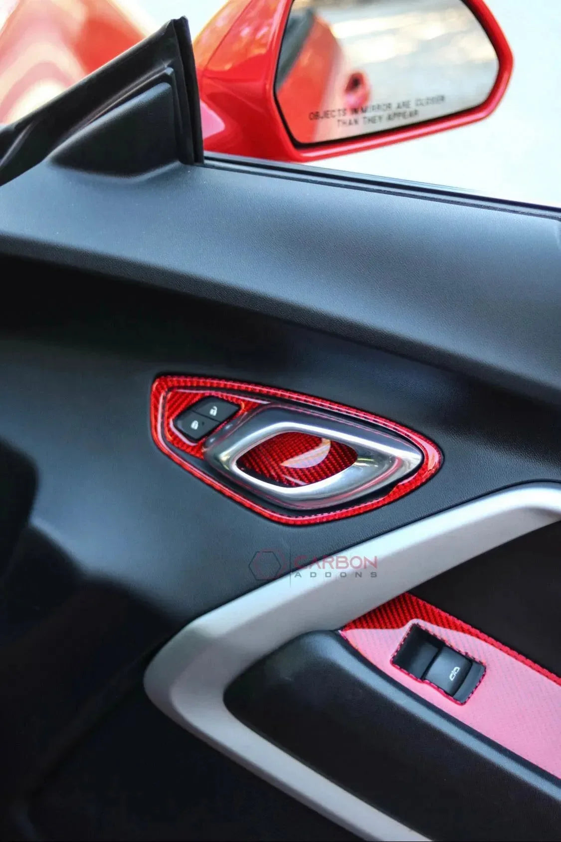 Red carbon fiber door panel trim for American muscle cars, enhancing interior style with real carbon accents.