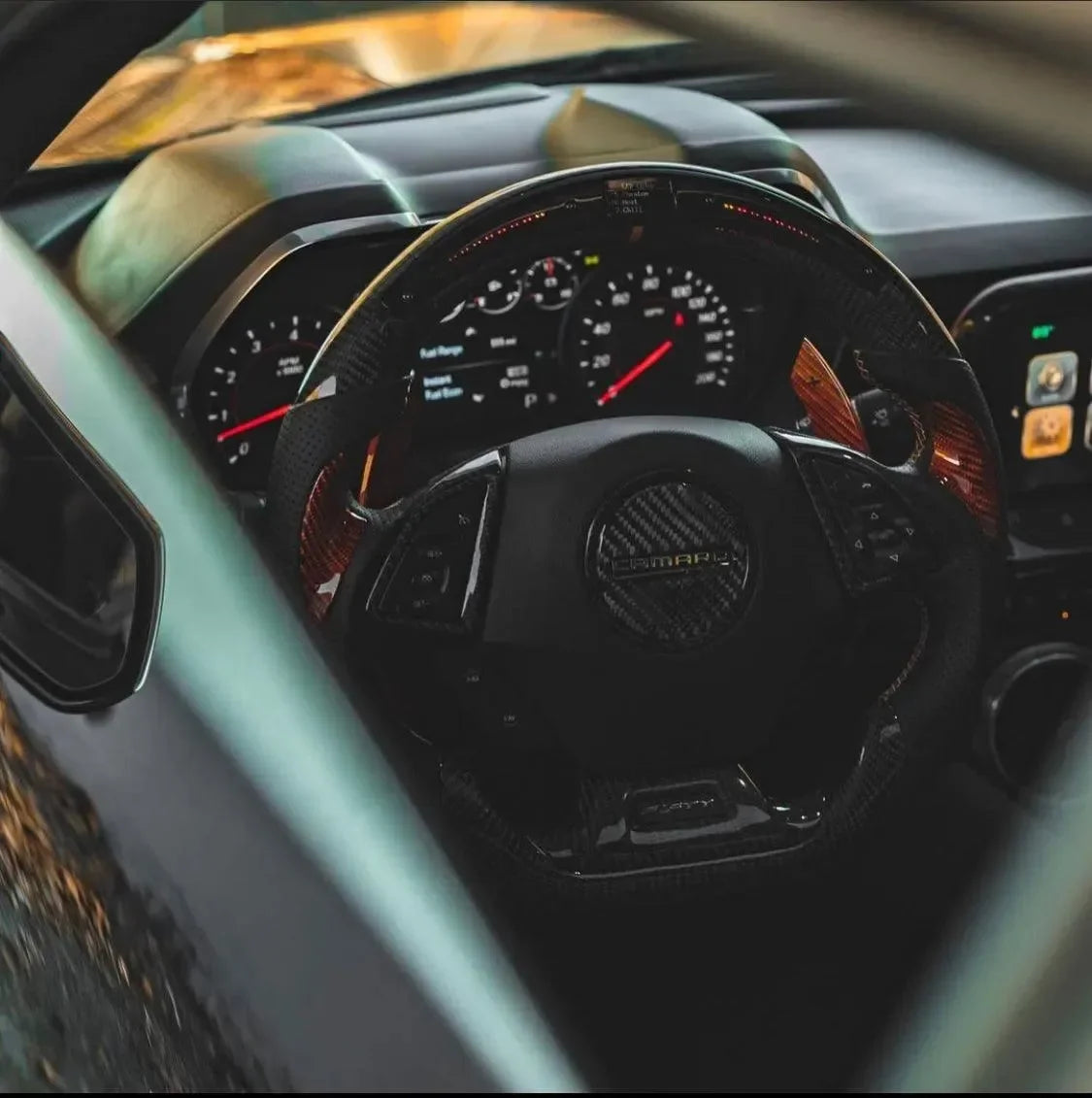 Chevy Camaro interior with real carbon fiber steering wheel and dashboard accents