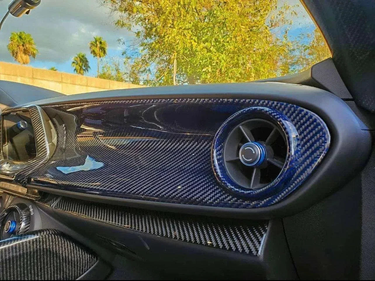 Real carbon fiber dashboard trim with blue-accented air vent for American muscle cars