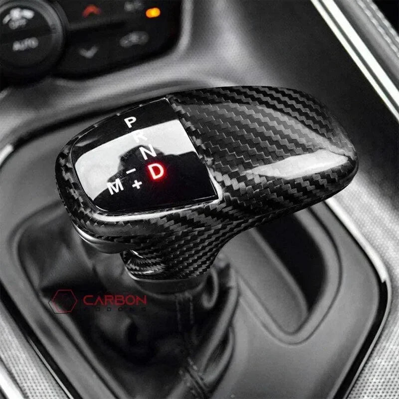 Real carbon fiber gear shift knob for American vehicles, sleek black weave design with illuminated P R N D indicators.