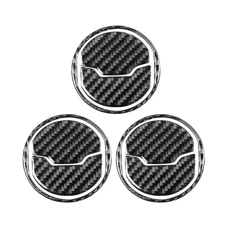Real carbon fiber wheel center caps for American vehicles, featuring sleek weave and chrome trim.
