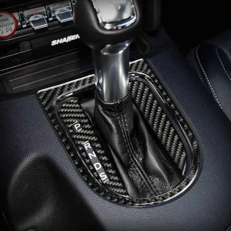 Real carbon fiber gear shift trim for Ford Mustang Shaker interior, sleek black leather boot with chrome accents