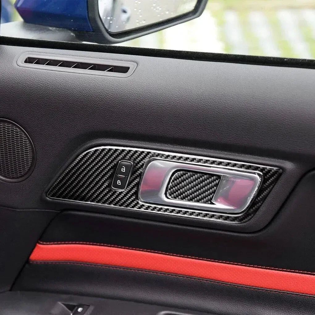 Real carbon fiber interior trim for car door panel with red stitching and window controls