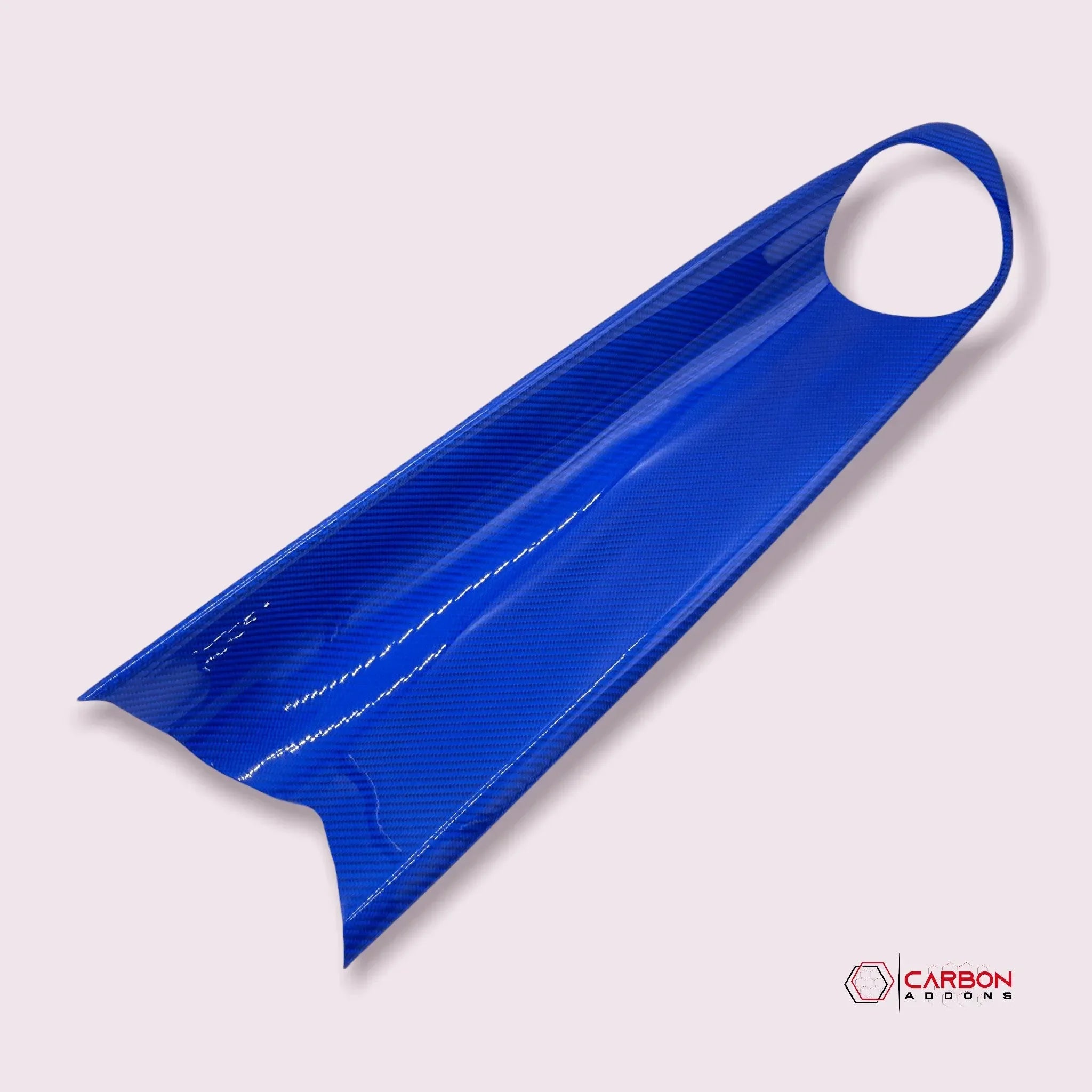 Blue carbon fiber automotive trim piece with glossy finish and precision cutout for vehicle customization