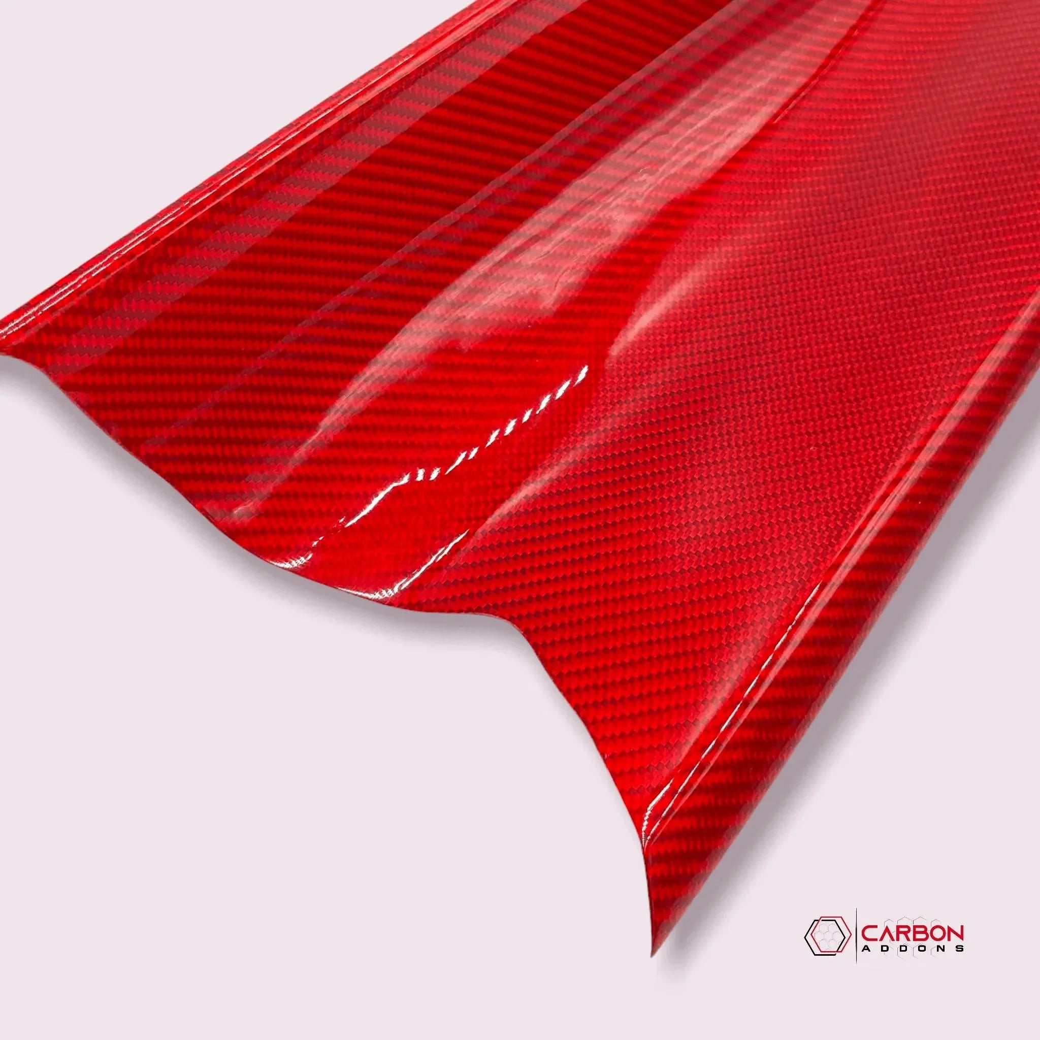 Glossy red carbon fiber automotive wrap with diagonal weave pattern for car customization