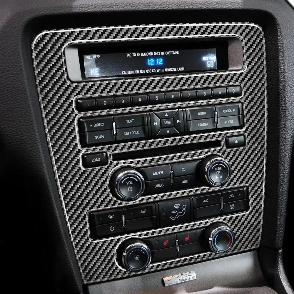 Real carbon fiber interior trim for Ford Mustang dashboard, enhancing audio and climate controls with sleek texture