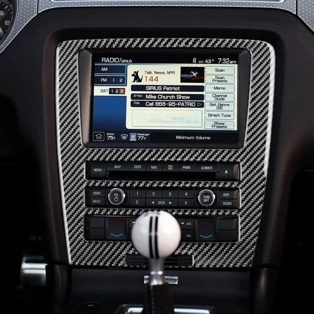 Real carbon fiber interior trim for Ford Mustang dashboard with touchscreen radio and manual shifter