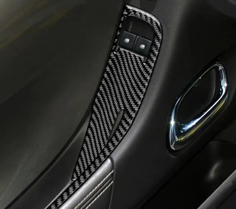 Carbon fiber interior trim for car door panel with sleek black finish and chrome accents