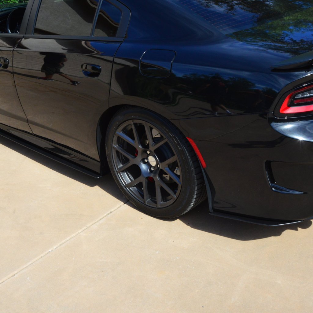 Black car parked on a concrete surface