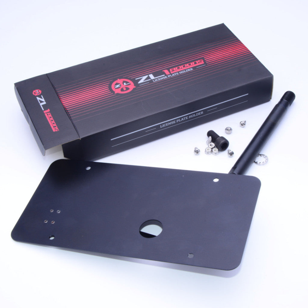 Black license plate holder with mounting hardware and ZL Racing box on a white background
