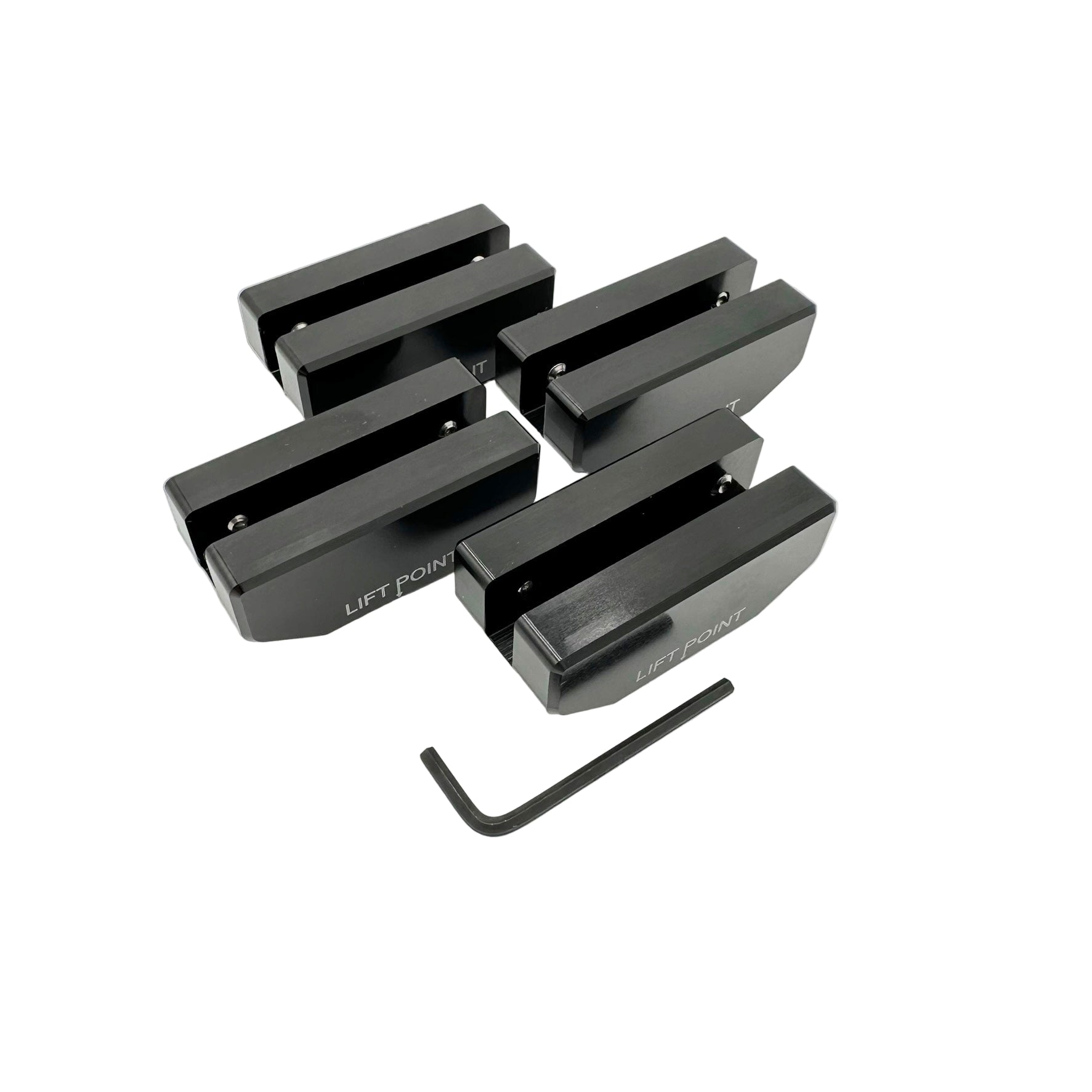 Set of black metal lift points with a wrench on a white background