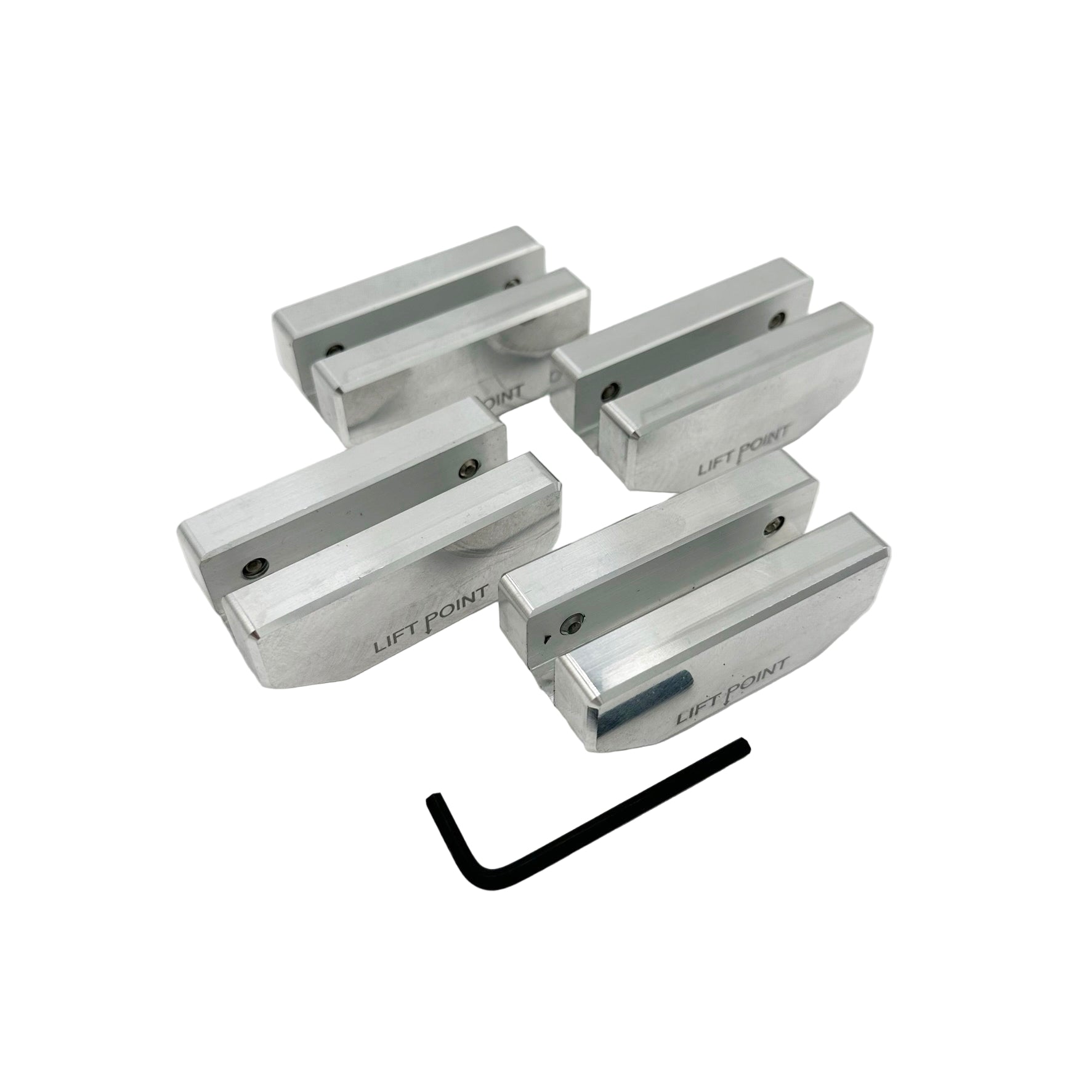 Set of metallic lift points with a wrench on a white background