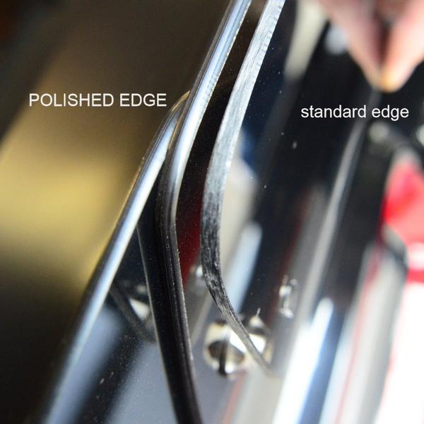 Comparison of polished and standard metal edges on a reflective surface.