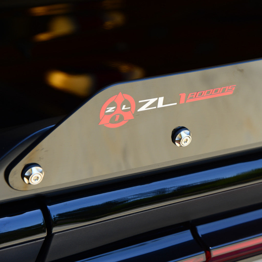 Metallic cover with 'ZL1' branding on a vehicle, featuring a logo.